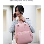 High-quality_mummy_diaper_backpack_with_multiple_compartments__Pink