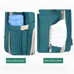 Multi-functional_baby_care_bag_with_insulated_milk_bottle_pockets__Green